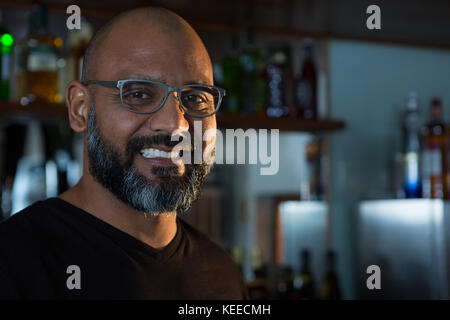 Portrait of man smiling in the bar Stock Photo
