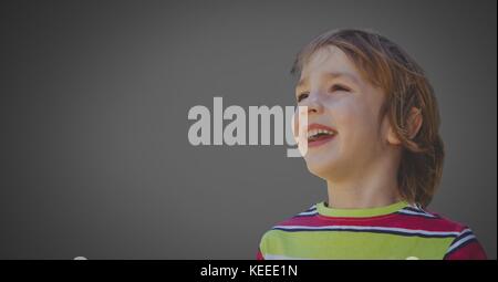 Digital composite of Boy against grey background happy Stock Photo