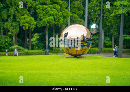 HAKONE, JAPAN - JULY 02, 2017: The Hakone Open-Air Museum or Hakone Chokoku No Mori Bijutsukan is popular museum featuring an outdoor sculpture park, huge metallic sfera at outdoor at Hakone, Japan Stock Photo