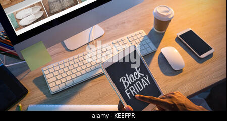 Cropped hands of buisnessman using digital tablet at workplace Stock Photo