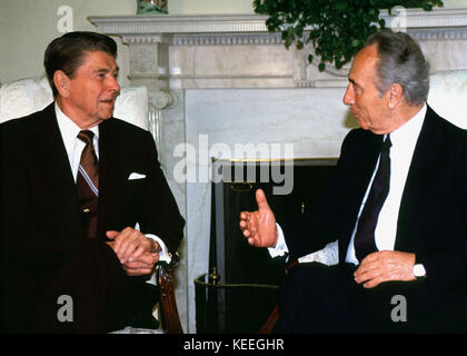 United States President Ronald Reagan meets Foreign Minister Shimon Peres of Israel in the Oval Office on Tuesday, May 17, 1988..Credit: Arnie Sachs / CNP /MediaPunch Stock Photo