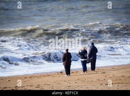 Burton Bradstock, Dorset, UK. 20th Oct, 2017. UK Weather. People enjoying the relative calm before the storm predicted to hit the UK later today on a sunny but blustery day at the beach. Credit: DTNews/Alamy Live Credit: Dan Tucker/Alamy Live News Stock Photo
