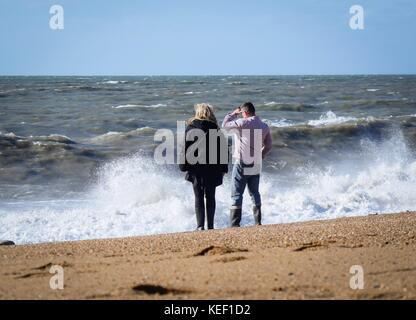 Burton Bradstock, Dorset, UK. 20th Oct, 2017. UK Weather. People enjoying the relative calm before the storm predicted to hit the UK later today on a sunny but blustery day at the beach. Credit: DTNews/Alamy Live Credit: Dan Tucker/Alamy Live News Stock Photo