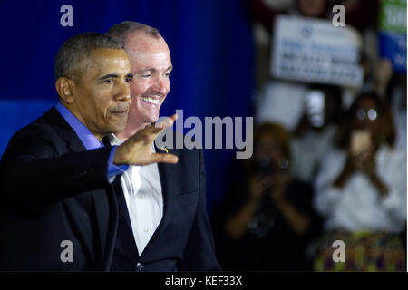 Newark, New Jersey, USA. 19th Oct, 2017. Former US President BARACK OBAMA joins PHIL MURPHY, democratic candidate in the New Jersey gubernatorial race on stage at an October 19, 2017 campaign rally, in Newark, New Jersey. The event is the return to the political stage for Obama after leaving the White House at the end of his historic two-term precedency. Credit: Bastiaan Slabbers/ZUMA Wire/Alamy Live News Stock Photo
