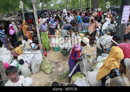 October 19, 2017 - Ukhiya, Bangladesh - Newly arrived Rohingya Muslims sit at a refugee camp in Ukhiya, Bangladesh, October 19, 2017. Thousands more Rohingya Muslims are fleeing large-scale violence and persecution in Myanmar and crossing into Bangladesh, where more than half a million others are already living in squalid and overcrowded camps, according to witnesses and a drone video shot by the U.N. office for refugees. (Credit Image: © Suvra Kanti Das via ZUMA Wire) Stock Photo