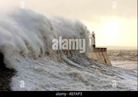 Porthcawl, Bridgend, Wales, UK. 21st Oct, 2017. UK Weather. Gale force winds and massive waves trom Storm Brian batter the South Wales coastline. Credit: Graham M. Lawrence/Alamy Live News Stock Photo