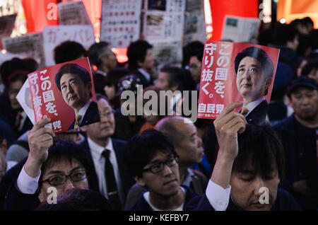 Shinzo Abe, October 18, 2017, Tokyo, Japan : Voters hold placards during the stump speech near the Ikebukuro Station in Tokyo, Japan on October 18, 2017.