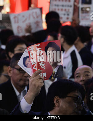 Shinzo Abe, October 18, 2017, Tokyo, Japan : Voters hold placards during the stump speech near the Ikebukuro Station in Tokyo, Japan on October 18, 2017.
