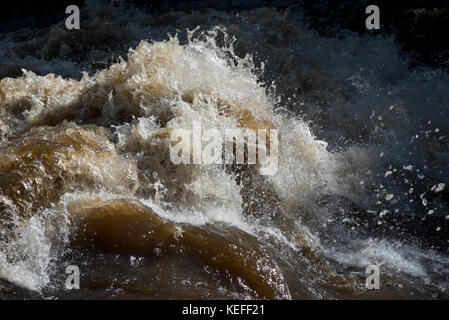 Watery abstract of the river Ure in full flow after heavy rain at Aysgarth in Wensleydale, Yorkshire Dales, England. Stock Photo
