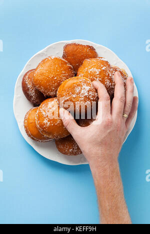 round jelly doughnut sufganiyah for Hanukkah, Jewish holiday commemorating the rededication of the Holy Temple Stock Photo