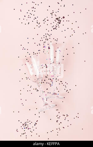 two champagne glasses isolated on an empty pink festive background Stock Photo