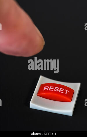 Reset Button Visual Macro-photo of small red Reset button - visual metaphor for staring ...