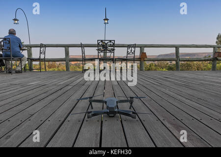 Drone ready to take off on a wooden deck. Stock Photo