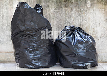 close-up of a full garbage bags on floor Stock Photo