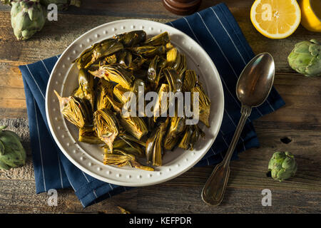 Roasted Organic Baby Artichokes with Lemon and Olive Oil Stock Photo
