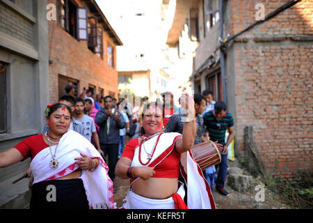 Newari People dance in a traditional instruments during Newari New Year parade Nhu Dan (the Newari New Year) falls during Tihar or Deepawali and Dewali “Festival of Lights” at Panga, Kirtipur, Kathmandu, Nepal on Friday, October 20, 2017. Newar community in Nepal observes Newari New Year 1138. Stock Photo