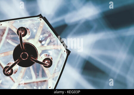 Old chandelier hanging on ceiling and creates artistic shadows pattern Stock Photo