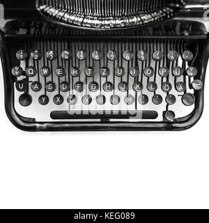 Old manual typewriter machine, fragment with keyboard over white background, square black and white photo with soft selective focus Stock Photo