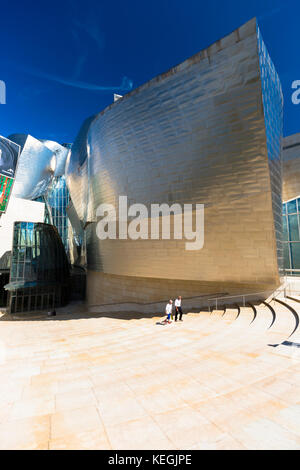 Visitors at Architect Frank Gehry's Guggenheim Museum in titanium and glass at Bilbao, Basque country, Spain Stock Photo