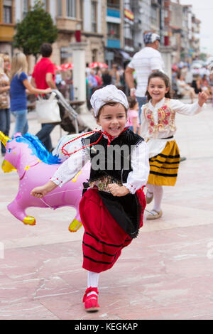 Girl playing at traditional fiesta at Villaviciosa in Asturias, Northern Spain Stock Photo