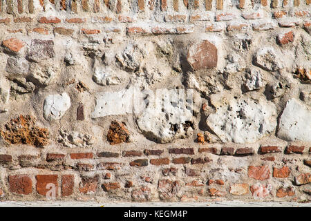 detail of antique and damaged rustic facade Stock Photo