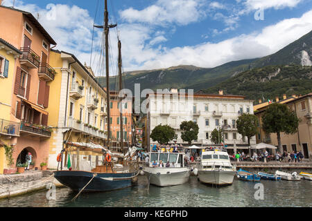 Town of Malcesine, Lake Garda, Italy. Picturesque view of tourist boats and river taxis berthed at Malcesine Port. Stock Photo