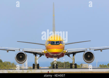 DHL (European Air Transport - EAT) Boeing 757-236(SF) [D-ALEH] lining up runway 31 for take off in the evening. Stock Photo