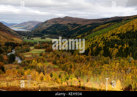 Autumn view towards Loch Bloom near UllapoolView of Autumn colours along the valley towards Loch Bloom and Ullapool  in Wester Ross, northwest Scotlan Stock Photo