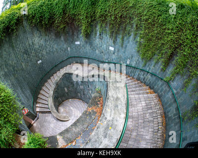 Spiral staircase of underground crossing in tunnel at Fort Canning Park, Singapore Stock Photo