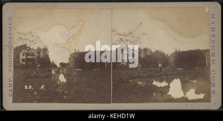 A farm scene showing men stacking hay, by Camp, D. S. (Daniel S.) Stock Photo