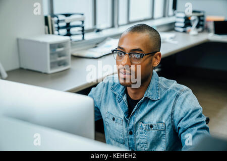 Black businessman using computer Stock Photo
