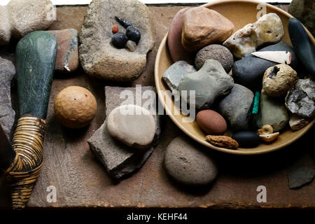 Stones in bowl and traditional tools Stock Photo