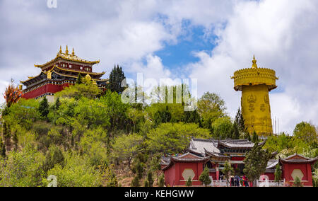 Giant tibetan prayer wheel and Zhongdian temple - Yunnan privince, China Stock Photo