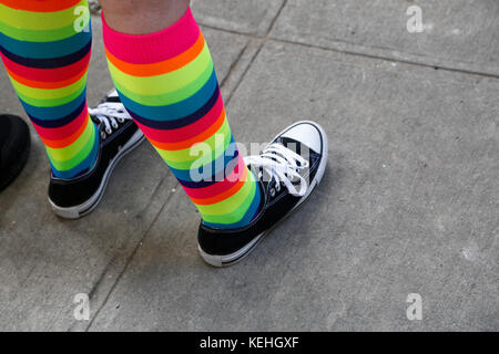 Close-up of a woman's legs wearing ankle socks in high heel shoes