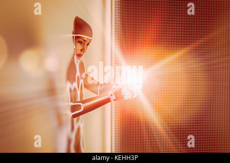 Light glowing in hands of futuristic woman emerging from wall Stock Photo