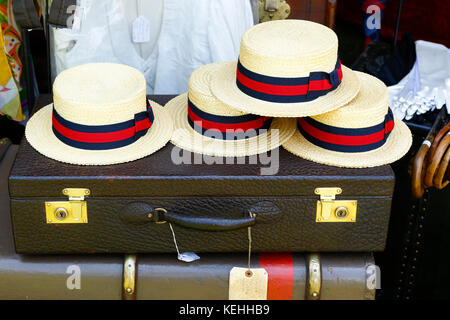 Straw hats on old-fashioned briefcase Stock Photo