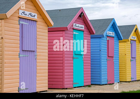 Colourful beach huts, Amble, Northumberland, England, UK Stock Photo