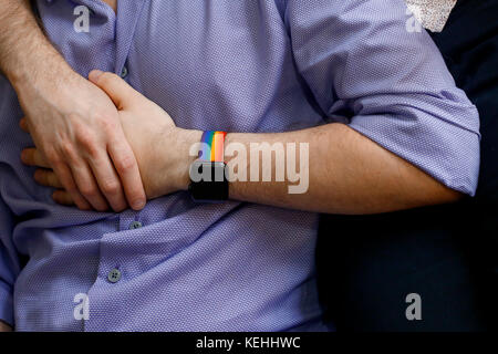 Caucasian men holding hands Stock Photo
