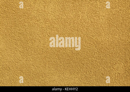 Yellow painted stucco wall. Background texture. Stock Photo