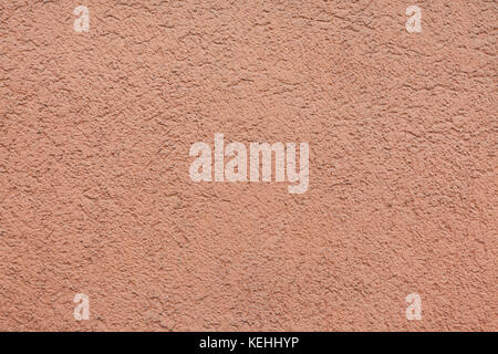 Pink painted stucco wall. Background texture. Stock Photo