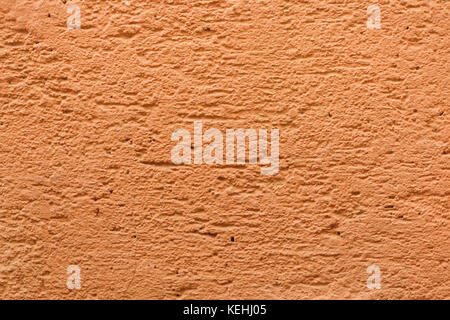 Yellow ochre painted stucco wall. Background texture. Stock Photo