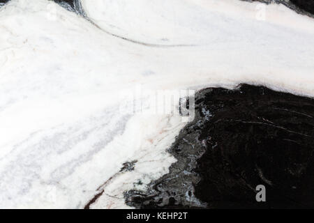 Close up of black and white marble, pastel color mix, macro shot. High resolution photo. Stock Photo