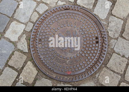 Bohemian heraldic lion depicted on the manhole cover in Litomyšl, Czech Republic. Stock Photo