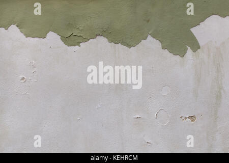 Old wall with cracked plaster. Background texture. Stock Photo