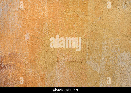 Yellow ochre painted stucco wall. Background texture. Stock Photo