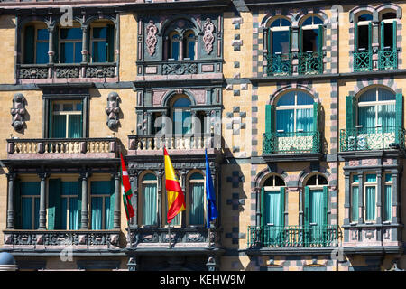 Basque, Spanish and European Union EU flag on Delegation of the Government in Bizkaia at Plaza Moyua in Bilbao, Spain Stock Photo