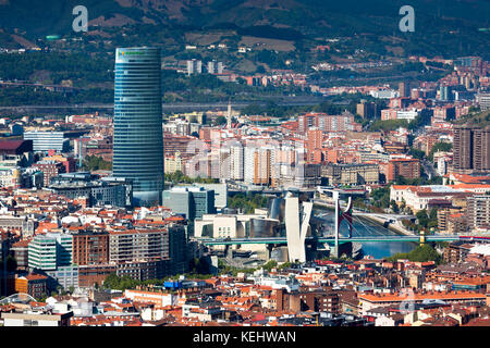 Aerial view of Bilbao Guggenheim Museum, Iberdrola Tower skyscraper and Red Bridge in Basque country, Spain Stock Photo
