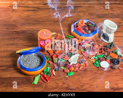 aromatic scene with incense sticks, lavander and dry flowers Stock Photo