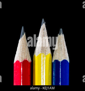 A macro shot of three pencils shot against a black background. Stock Photo