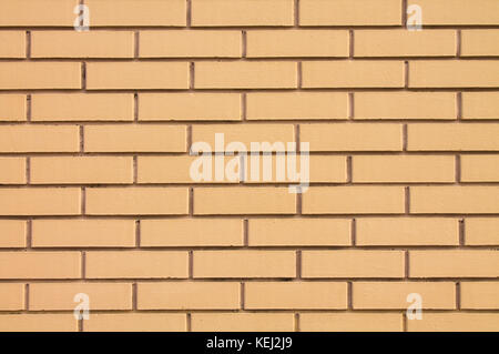 A new wall of brown brick for the background. Stock Photo